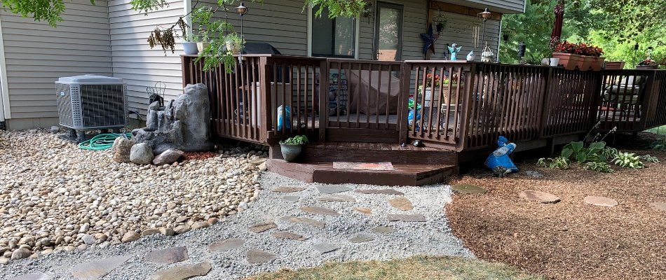 Home in Maineville, OH, with backyard deck and walkway.