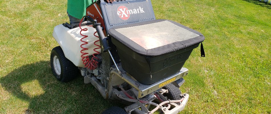 Granular lawn care spreader on grass in Delaware, OH.