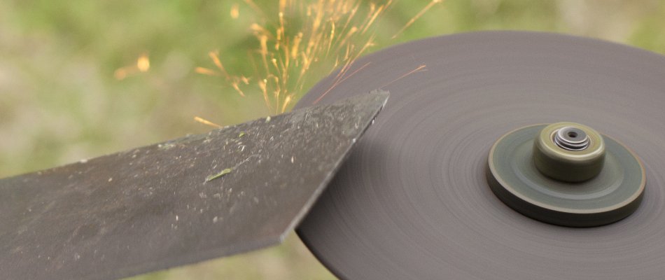 Sharpening the blades of a lawn mower in Paradise Valley, AZ.