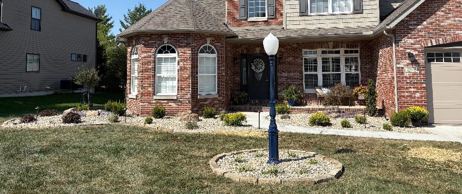 Front yard in Edwardsville, IL, with rock landscape beds.