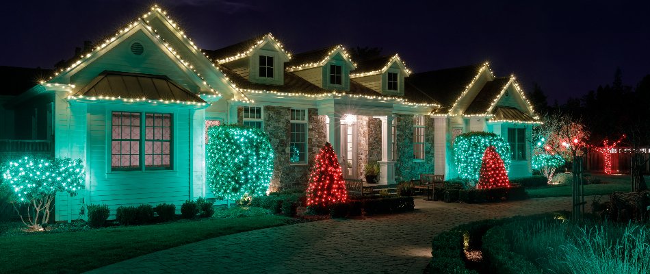 Holiday lighting on a home with red and green lights in Charlotte, NC..