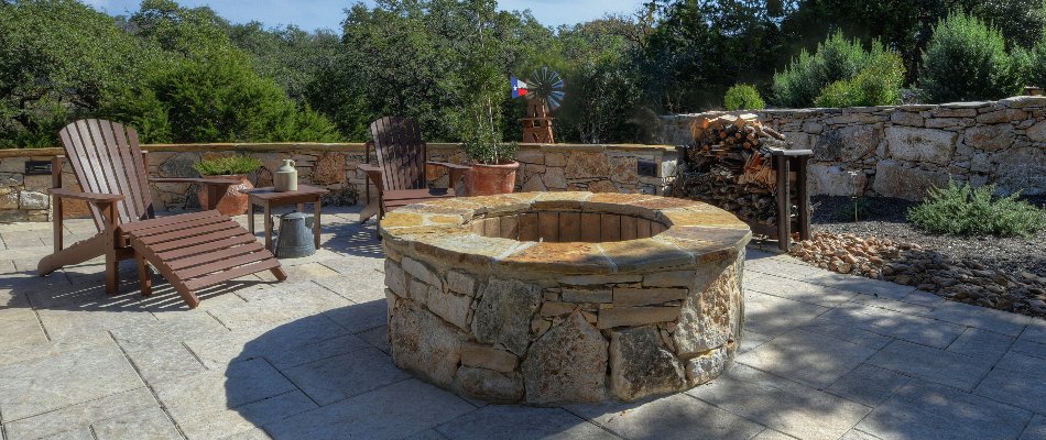 Chairs around a round fire pit in New Braunfels, TX.