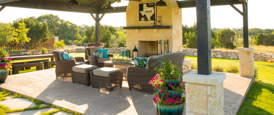 Pavilion with outdoor fireplace and furniture in New Braunfels, TX.