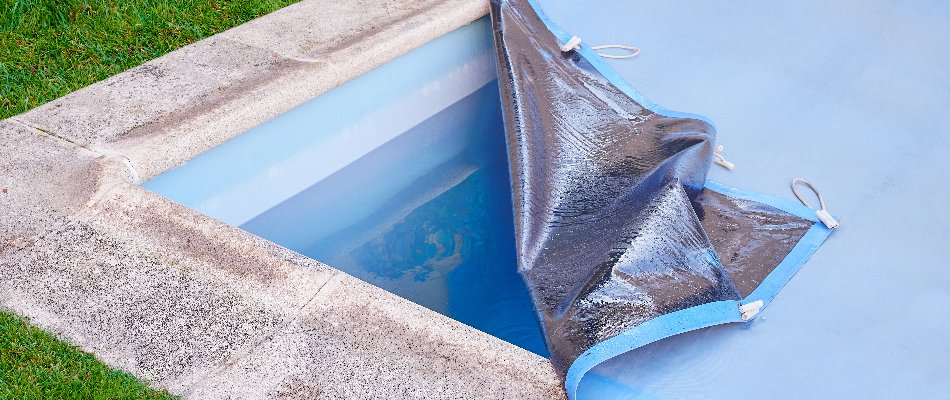 Partially lifted pool cover in Cary, NC.
