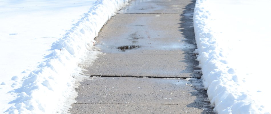Snow along a cleared walkway in Matthews, NC.