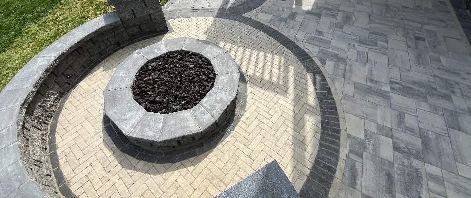 Uniquely designed paver patio with a fire pit in Omaha, NE.