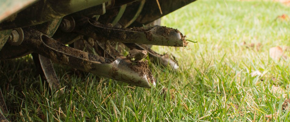 Closeup of aerator tines on a lawn in Mansfield, OH.