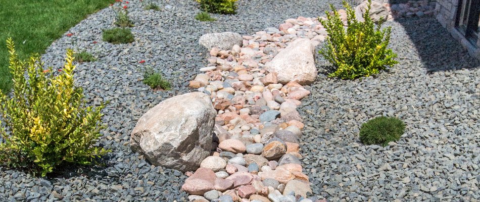 Dry creek bed as drainage solution in Edwardsville, IL.