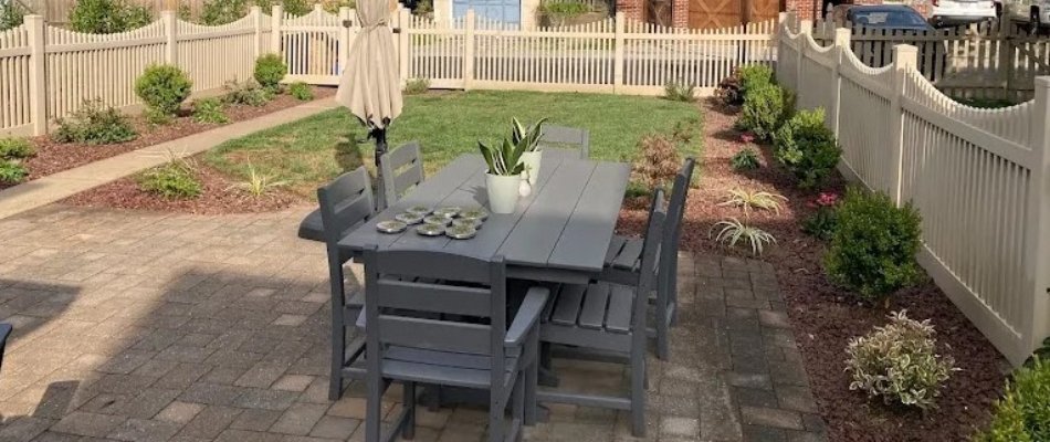 Backyard landscaping installed along a fence in West Chester, PA.