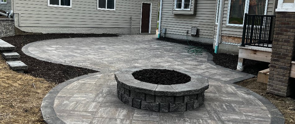 Patio in Omaha, NE, with a fire pit.