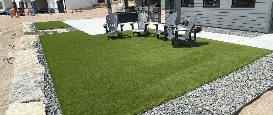 Artificial turf in Omaha, NE, with wooden chairs.