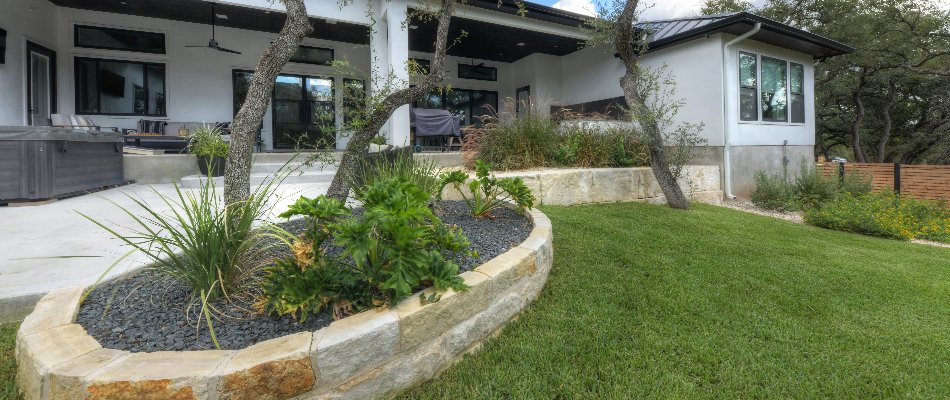 Raised landscape beds behind a house in New Braunfels, TX.
