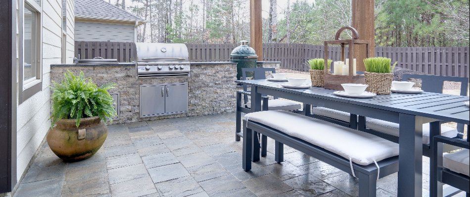 Dining set in an outdoor kitchen in Ankeny, IA.
