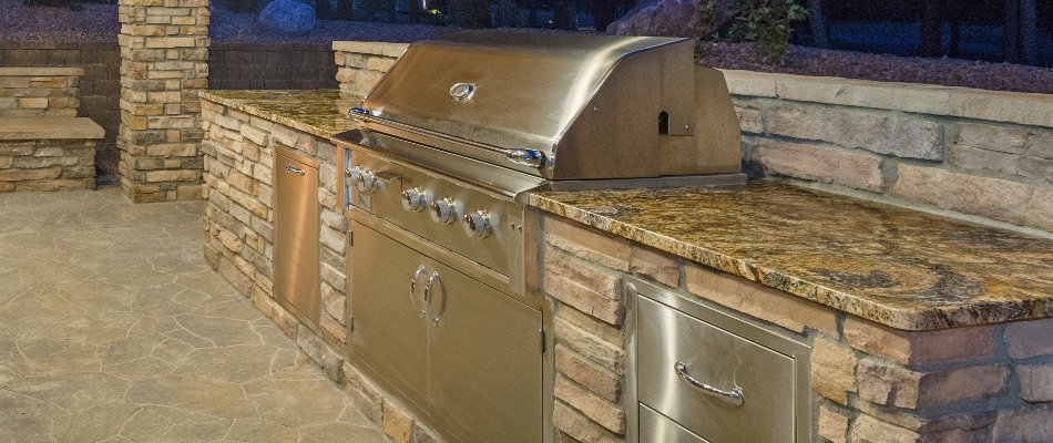 Outdoor kitchen in Ankeny, IA, with grill and extra counterspace.