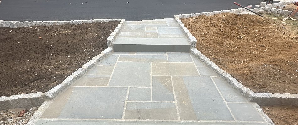 Bluestone walkway in Chester Springs, PA, connecting to a driveway.