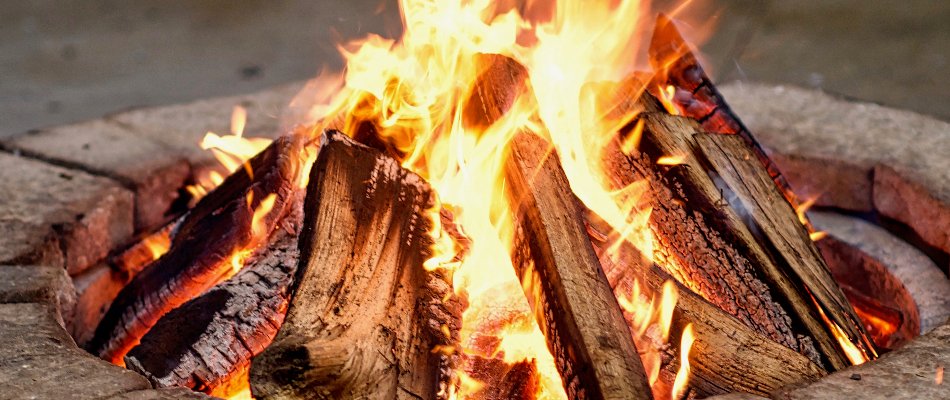 Closeup of fire on a wood-burning fire pit in Paradise Valley, AZ.