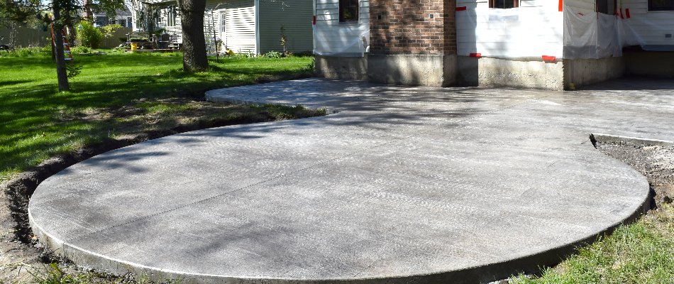 Poured concrete patio on a property in Macomb, MI.