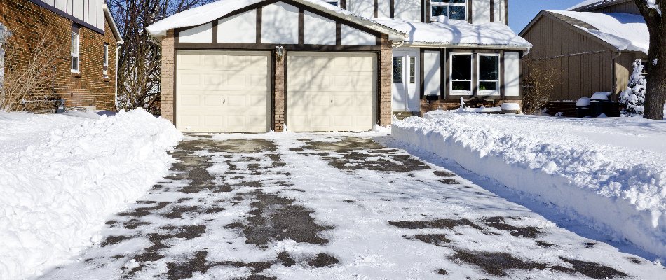 House in Matthews, NC, with a snow-cleared driveway.