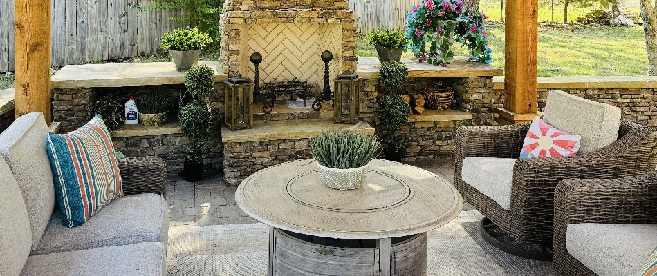 Furniture in front of an outdoor fireplace in Huntsville, AL.
