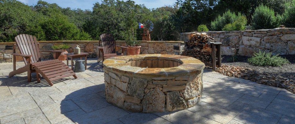 Round fire pit with chairs in New Braunfels, TX.