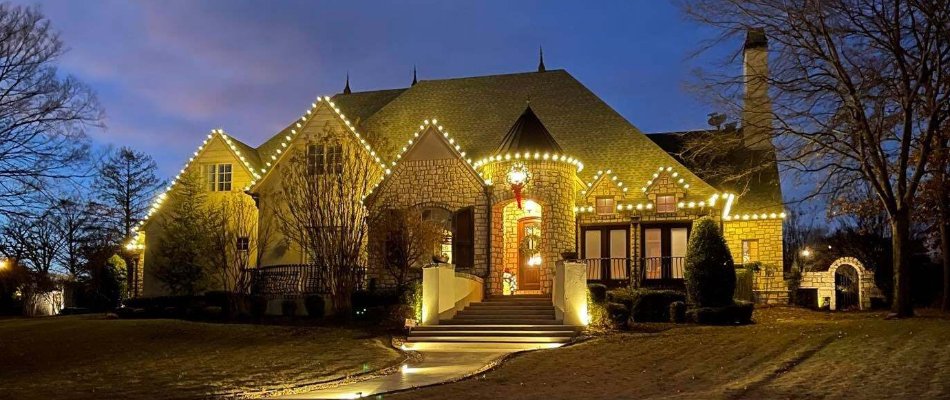 Beautiful house in Tulsa, OK, with warm white holiday lights.