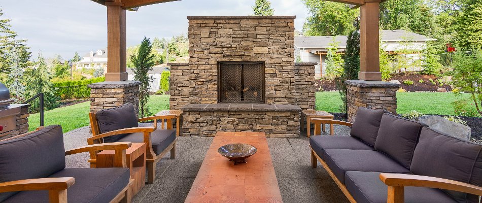 Outdoor fireplace and outdoor furniture on a property in Matthews, NC.