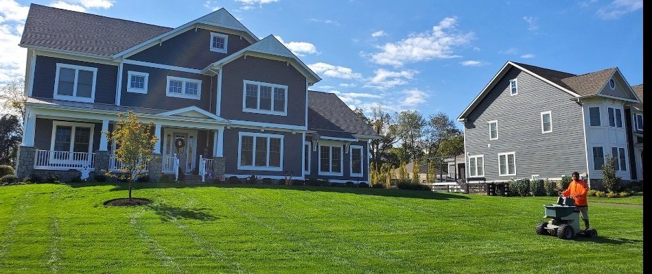 Residential lawn being treated with fertilizer in South Riding, VA.