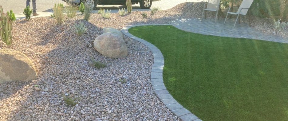 Landscape bed in Paradise Valley, AZ, with rocks, stones, and plants.