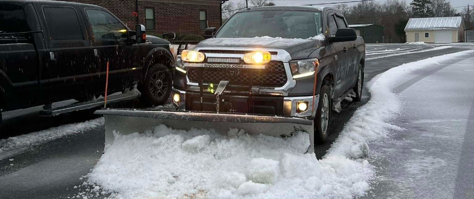 Snow truck removing snow from a street in Matthews, NC.