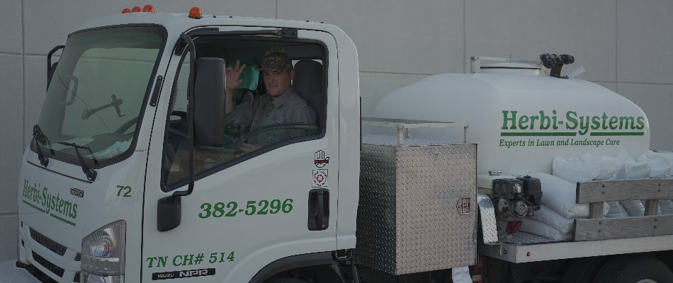 Tech in a white company truck in Memphis, TN.